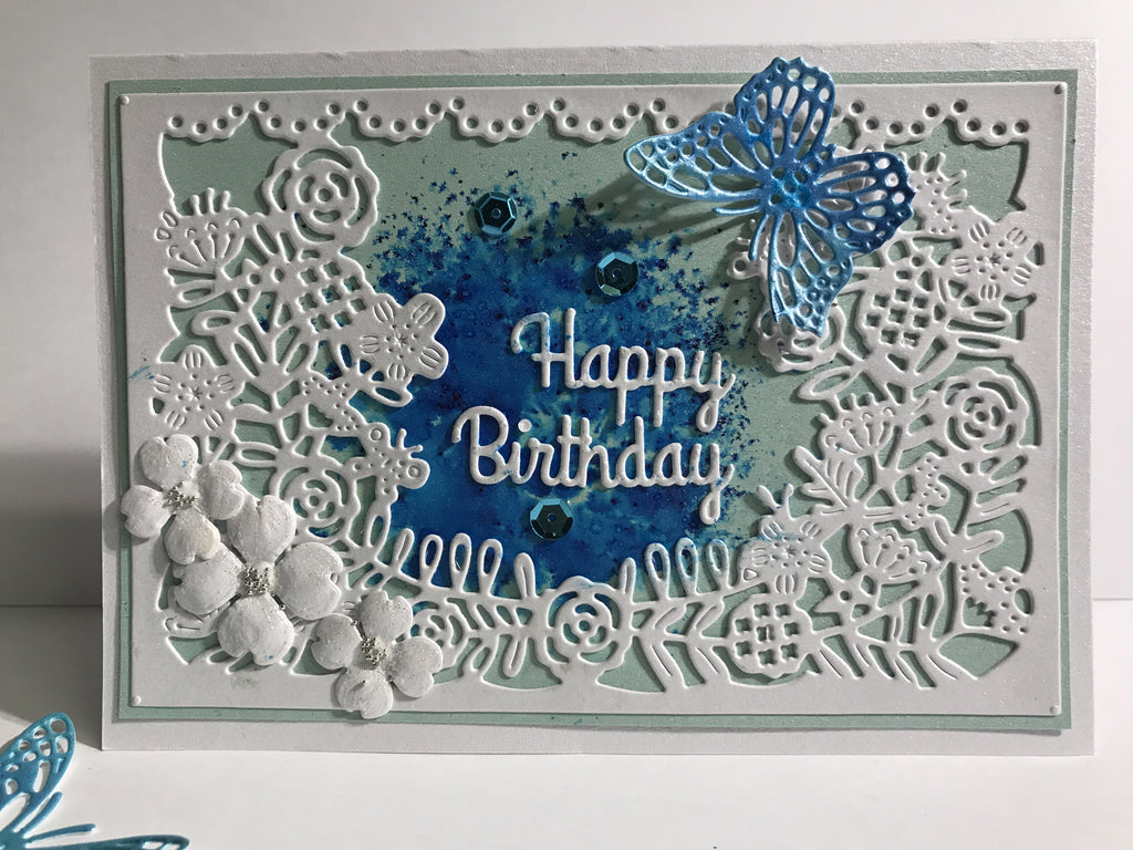 Delicate flower frame and turquoise butterfly