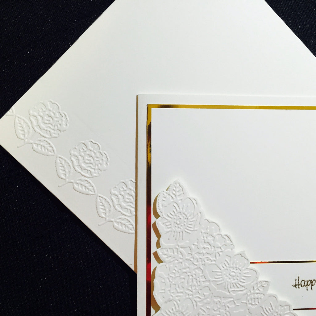 Classic embossed roses in cream and gold